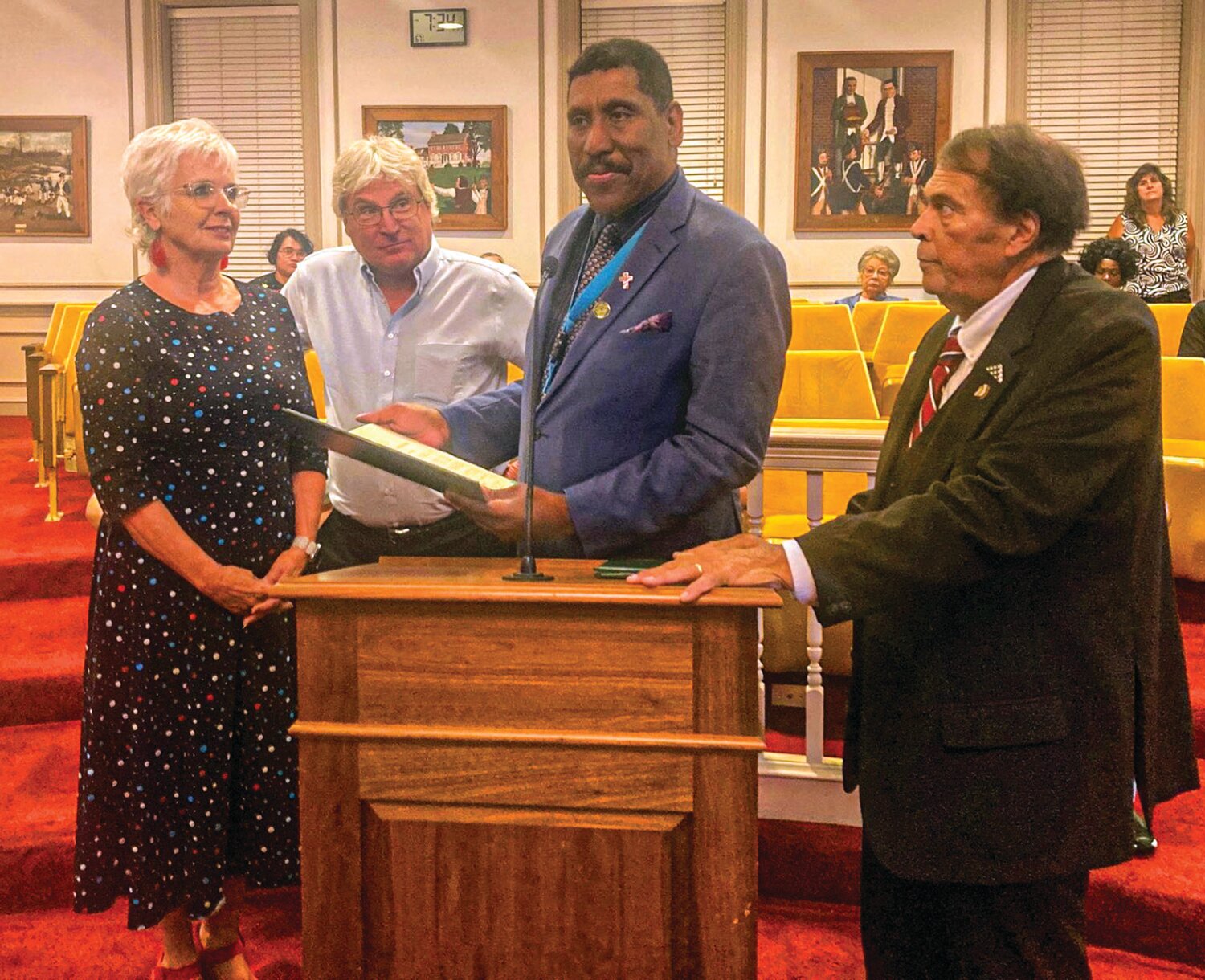 From left, Tonda Parks,  associate publisher of the Daily State News, and Editor-in-Chief Andrew West accept a Certificate of Recognition from Dover City Councilman David L. Anderson commemorating the State News' 73rd birthday at a council meeting Monday. Mayor Robin Christiansen looks on. DAILY STATE NEWS/MIKE FINNEY