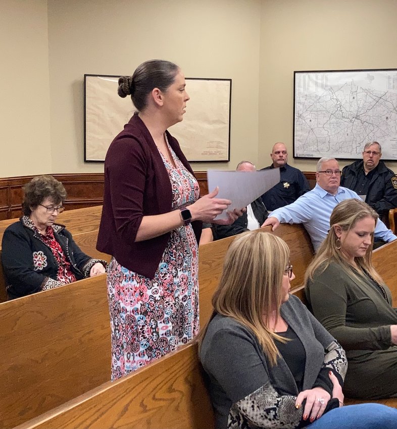 Assistant District Attorney Keri Miller submits recommendations for the newly formed Sexual Assault Response Team during Gonzales County Commissioners Court Monday.