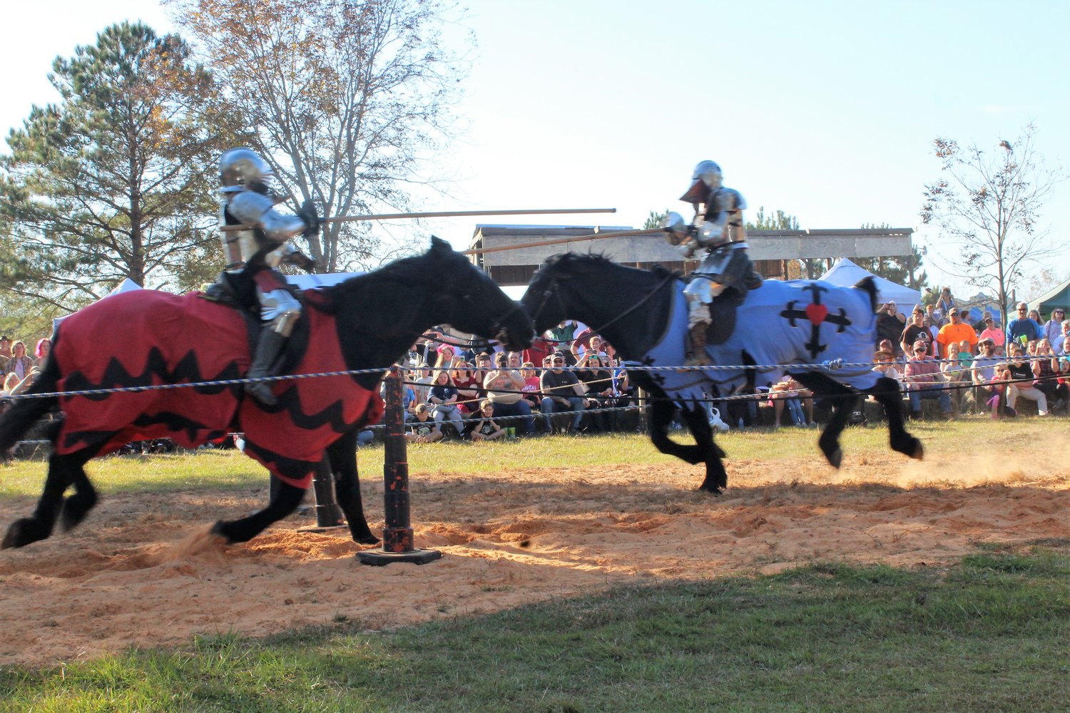 Competitors with the Knights of Valor full contact jousting make a pass during festivities on Saturday, Nov. 20 at the Jubilee Renaissance Faire at Medieval Village in Robertsdale.