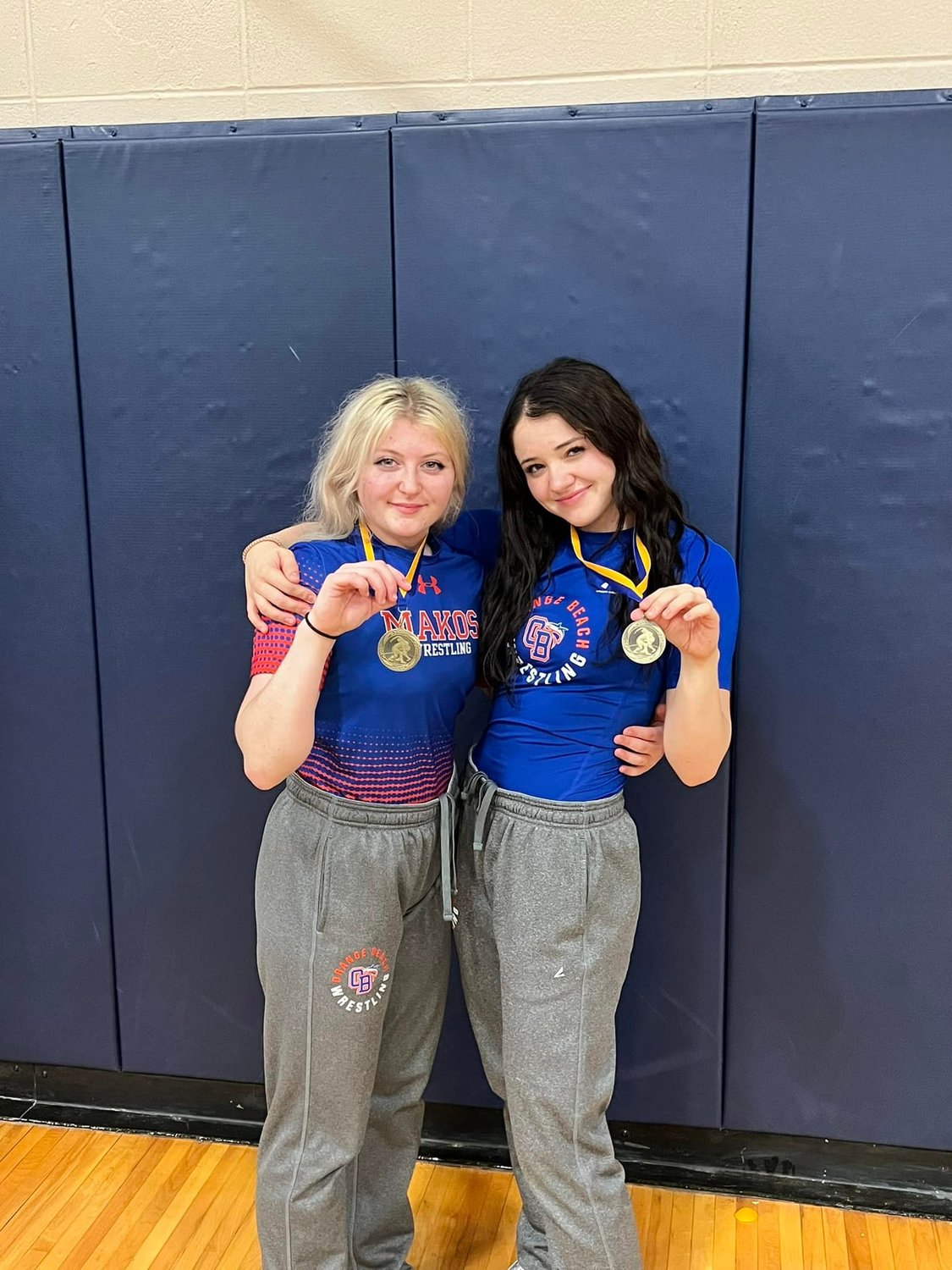 Grace McAleer and Ashlyn Bush, each medaled in their respective weight classes at the Baldwin County Championship.
