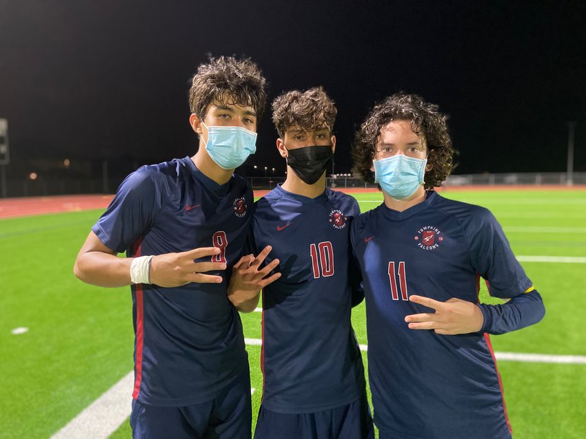 From left to right, Tompkins junior midfielder Rafa Gonzales, sophomore midfielder Luis Lugo and senior midfielder Jose Ojeda lifted the Falcons to a 4-2 Class 6A area playoff win over Cy-Fair on Tuesday, March 30, at Jordan High School.