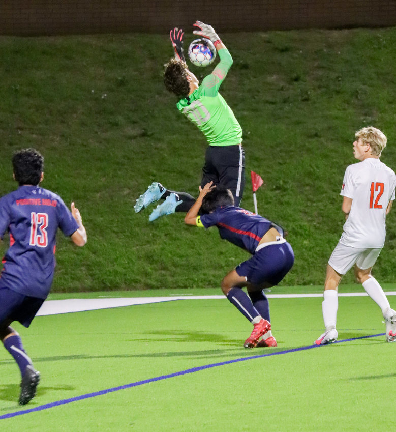 Tompkins senior goalkeeper Paulo Valente goes up for a save during the Falcons&rsquo; Class 6A regional quarterfinal win over Seven Lakes on Friday, April 2, at Rhodes Stadium.