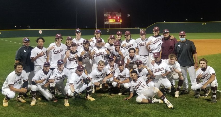 Cinco Ranch baseball players and coaches pose for a photo after their 7-6 Class 6A bi-district playoff win over Ridge Point on Friday, May 7, at Cinco Ranch High.