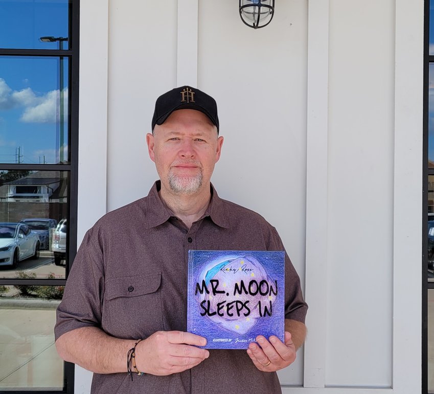Ricky Ross holds a copy of his first book, &ldquo;Mr. Moon Sleeps In&rdquo; which is set for release on Nov. 15. Ross has additional books set for publishing over the next year and a half and is working to donate copies of those books to Katy ISD libraries to support children&rsquo;s literacy throughout the Katy area.