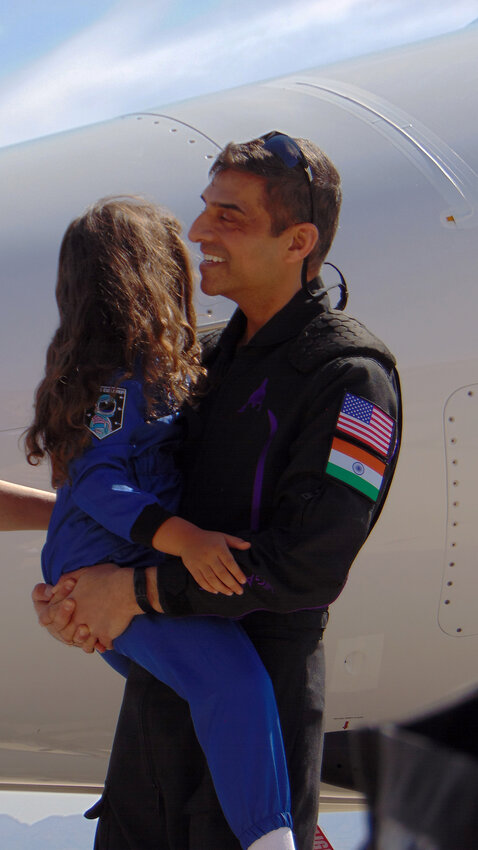 Anand “Andy” Harish Sadhwani and his daughter after his flight on the VSS Unity