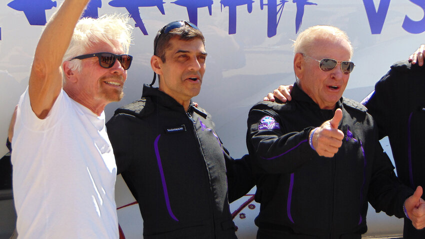 Richard Branson greets the crowd as he stands with the astronauts of the Virgin Galatic 07 launch at Space Port America June 8.