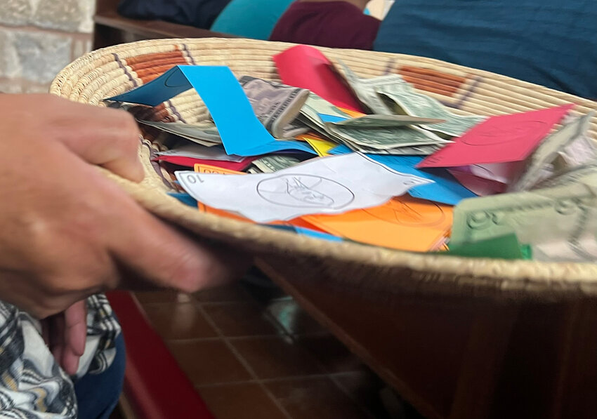 The collection plate at the St. Joseph’s Mission Church in Mescalero’s June 30 mass filled with slips of paper instead of cash in protest of the removal of cherished icon The Apache Christ.
