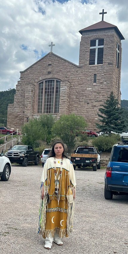 Kathrin Kie wears full Apache dress for the June 30 mass and following discussion at St. Joseph’s Mission Church in Mescalero.