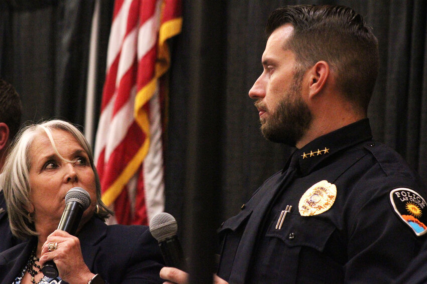 Gov. Michelle Lujan Grisham looks to Las Cruces Police Chief Jeremy Story while answering a question at a town hall meeting at the Las Cruces Convention Center on July 25, 2024.
