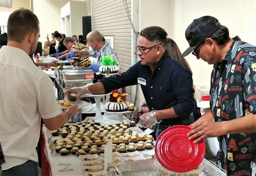 Contestants serve attendees of the 2022 Men Who Cook annual fundraising event in Las Cruces, benefitting Mesilla Valley Hospice.