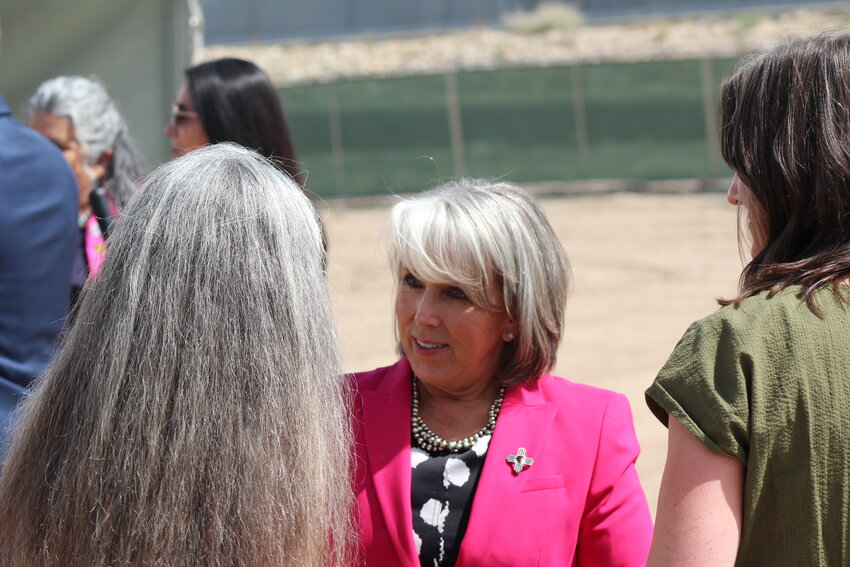 Gov. Michelle Lujan Grisham greets officials from University of New Mexico and Planned Parenthood of the Rocky Mountains at a groundbreaking for a reproductive health care clinic in Las Cruces on Sept. 5, 2024.