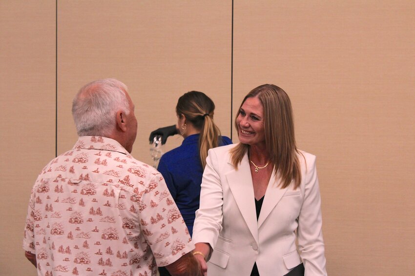 Monica Lounsbery greets a community member at the Las Cruces Convention Center on Sept. 12, 2024, after a presentation on her candidacy for New Mexico State University’s presidency.