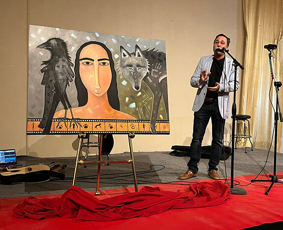 Ross Marks, executive director of the Las Cruces International Film Festival talks about festival poster artist Virginia Maria Romero after revealing the poster, titled “Nature Speaks,” Friday, March 7, at the New Mexico Farm & Ranch Heritage Museum in Las Cruces.