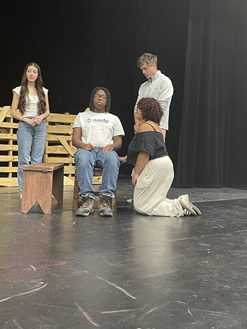From the left: Juliana Garcia as Fantine, Tyson Reyes as Jean Valjean, Luther Elliss as Marius, and Astrid Johnson (in front kneeling) as Cosette.