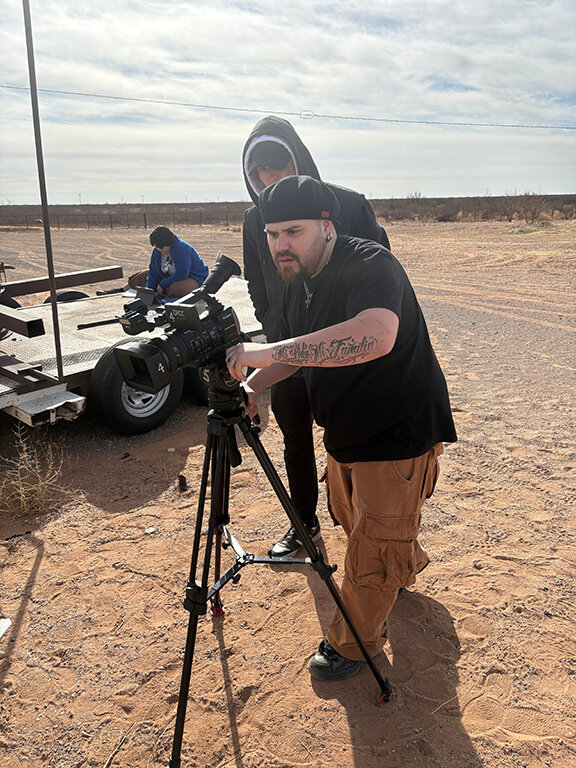 Lead actor Austin M. Lucero lines up a shot with director of photography Hezekiah Oates