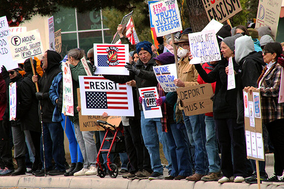 A crowd of people carrying signs lined Main Street and gathered at Albert Johnson Park at the Hands Off! Protest on April 5, 2025. The nationwide protest to oppose President Trump’s recent executive orders and policy changes implemented by the Department of Government Efficiency.