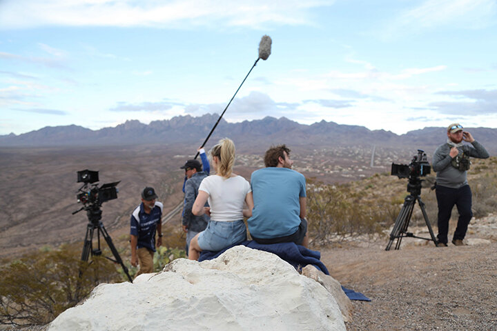 Cast and crew members enjoy the magnificent landscape as they film at the top of Tortugas Mountain during the making of "3."