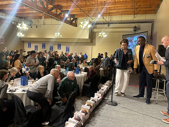 Jennifer Kozlowski, Boys and Girls Club Director of Resources and Development, escorts Tim Brown to begin his Q&A with Adam Young, TV/Radio Sportscaster for New Mexico State University.