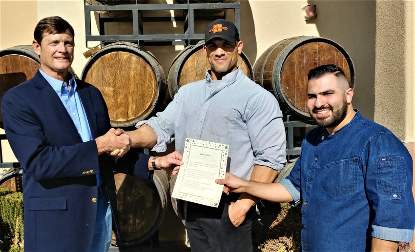 Las Cruces Dress the Child program coordinator Doug Boberg, left, was at Lescombes Family Vineyards a few days before Christmas to thank General Manager Thomas Perez, center, and Executive Chef Kevin Chavez for Lescombes&rsquo; long-time support of Dress the Child. The program could not hold a fundraising dinner in either 2020 or 2021 because of the pandemic, so Lescombes donated a dinner for eight, which Boberg raffled off among table hosts from previous years&rsquo; dinners. The winner was Mynatt Mart&iacute;nez Springer P.C. law firm of Las Cruces. The raffle raised $3,500. Dress the Child dressed 99 economically deprived students from the Gadsden Independent School District and 20 from Las Cruces Public Schools during shopping events earlier this month, Boberg said. It expects to dress an additional 100 LCPS students in early 2022. Each participating child receives $130 to $150 in new clothes and shoes in Dress the Child&rsquo;s partnership with local merchants. Send donation checks to Dress the Child, P.O. Box 550, Las Cruces, N.M. 88004, or take them to Julie Koenig, First New Mexico Bank, 3000 E. Lohman Ave. in Las Cruces. Contact Boberg at 575-644-9469 or drboberg@gmail.com.