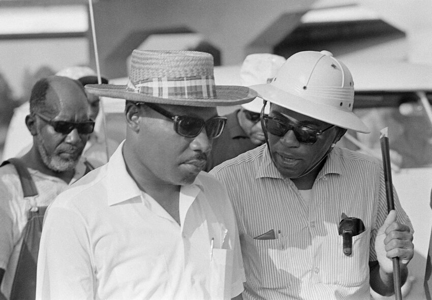 James Meredith (right) consults with Dr. Martin Luther King Jr., who continued the March Against Fear when Meredith was incapacitated by a bullet.