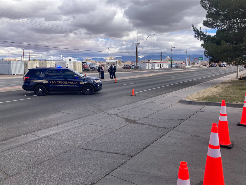 Police officers are seen on W. Picacho Avenue in Las Cruces on Jan. 22, when part of the street was temporarily closed to investigate an unknown item left at the Adult Probation and Parole office.