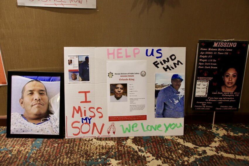 Posters of Indigenous people who have gone missing line the hallway of an Albuquerque hotel on Missing in New Mexico Day in December 2023.
