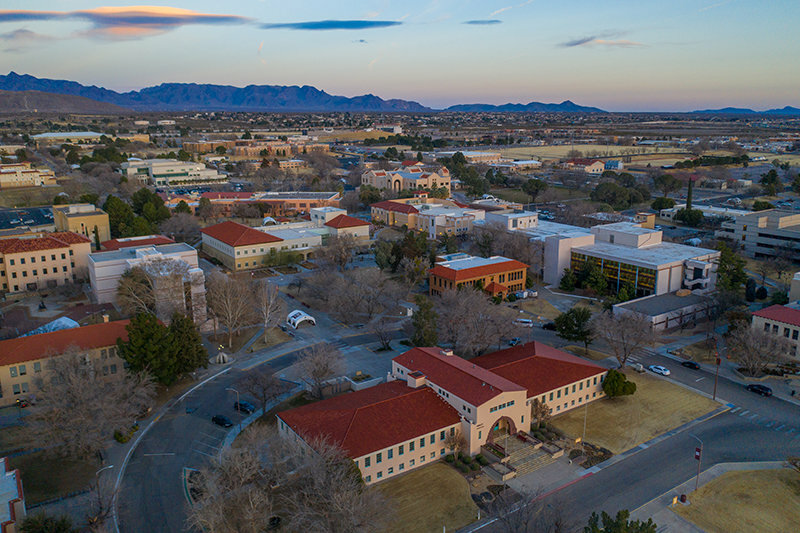 Aerial view of New Mexico State University's Las Cruces campus, with the Hadley Hall administrative building in the foreground.