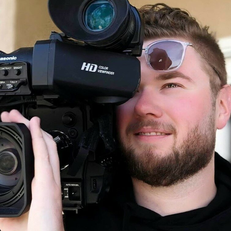 Photojournalist Jesse Walden, a graduate of New Mexico State University, is seen in a professional portrait for Spectrum News 13 in Orlando. Fla.