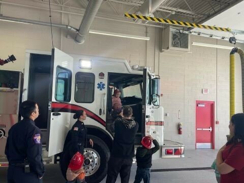 Children explore a fire truck at the newly opened Fire Station 2 in Anthony, N.M. during the station&rsquo;s ribbon-cutting and party on March 13.