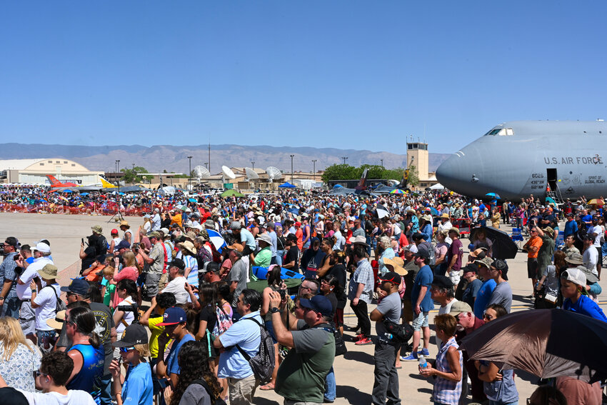 Spectators gather to watch aerial performances during the 2022 Holloman Legacy of Liberty Air Show and Open House May 7, 2022, Holloman Air Force Base, New Mexico. The air show featured aerial acts from the U.S. Air Force Demonstration Squadron, the F-35A Lightning II Demonstration Team, the A-10C Thunderbolt II Demonstration Team and several legacy aircraft. (U.S. Air Force photo by Airman 1st Class Antonio Salfran)