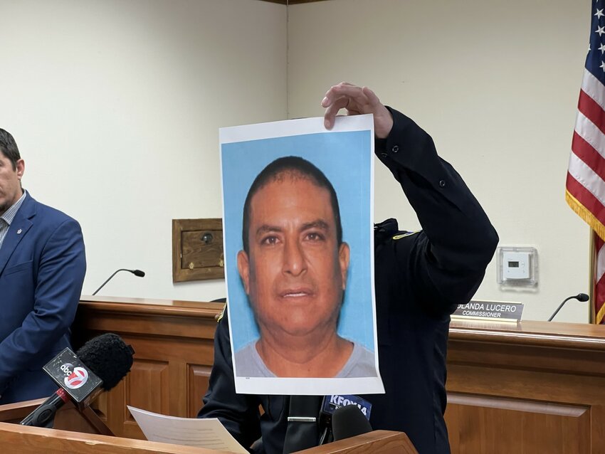 Mesilla Marshal Sgt. Tress Diaz holds up a photo of Oscar Renee Sandoval, the person of interest named in the April 1 homicide.