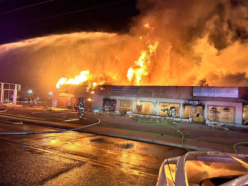 An abandoned commercial building on S. Espina Street burns early Saturday morning, April 13.
