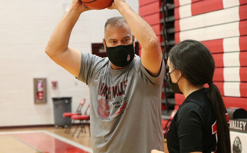 Ben Trujillo coaches a player on the Hatch Valley girls&rsquo; basketball team in 2021, during &ldquo;the Covid-19 season.&rdquo;