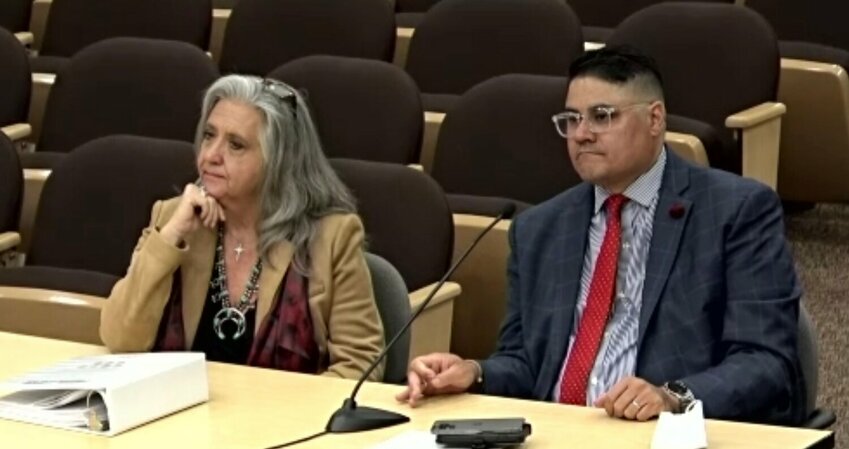 Alma d&rsquo;Arte Charter High School board president Richelle Peugh-Swafford and principal Adam Amador appear before the state Public Education Commission in Santa Fe on April 19.