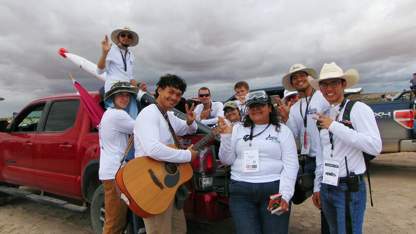The Atomic Aggies of New Mexico State University wait in line for a safety inspection during a long weather delay prior to launching their rocket during the Spaceport America Cup competition on June 21.