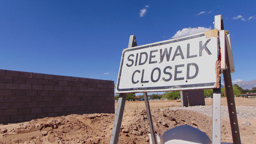A sign directs pedestrians around a construction project in Las Cruces, where a massive overhaul of development codes is in the works.