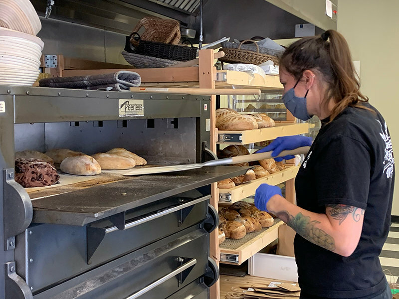 Kind Bread specializes in sourdough bread and baked goods. The business is seen in 2020, its first year of operation, in the midst of the COVID-19 pandemic.