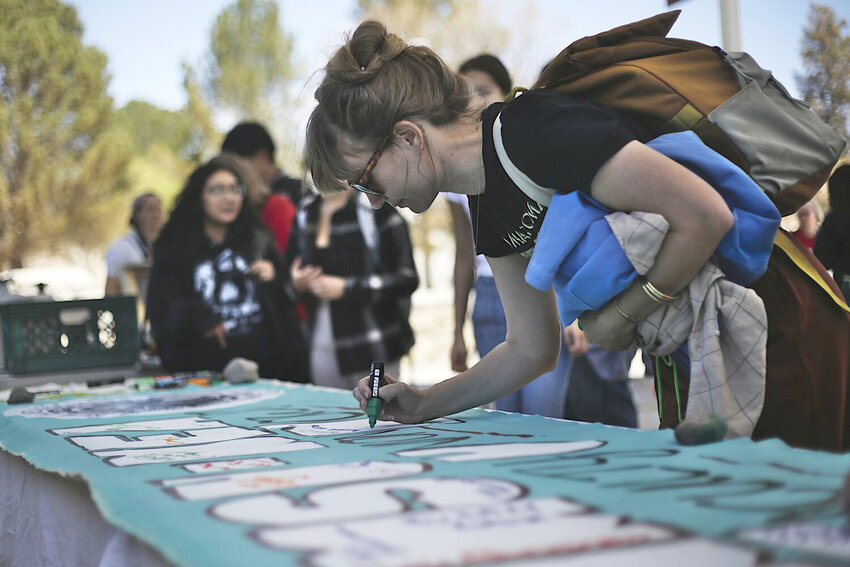 Thea De Armond, an adjunct faculty member in New Mexico State University&rsquo;s history department, signed a banner on March 29, 2024 supporting a faculty union.