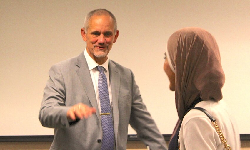 Valerio Ferme, a finalist for New Mexico State University president, speaks with a student after a presentation on the Las Cruces campus on Sept. 13, 2024.