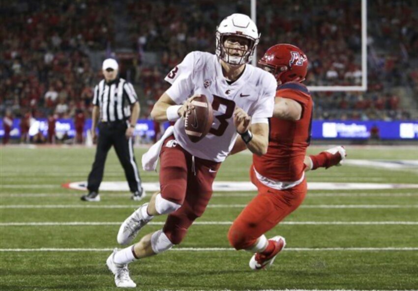 The late Tyler Hilinski is seen playing football for Washington State prior to his death in 2018.