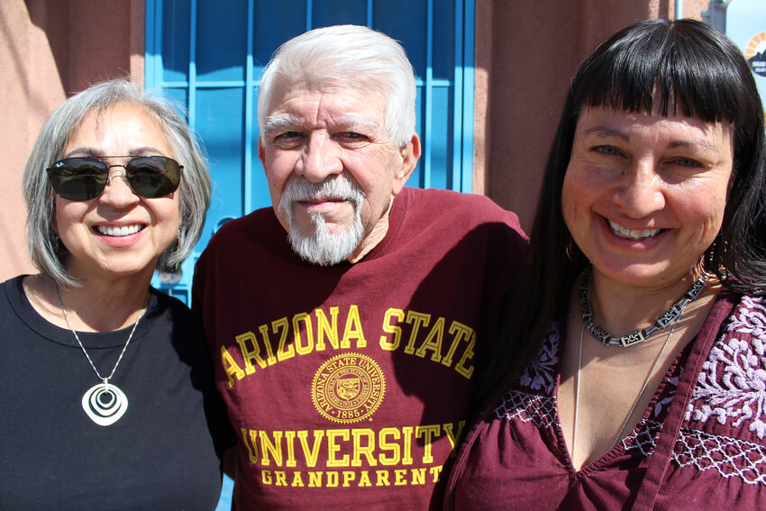 Martha Rodriguez, Antonio Luján and Corrina Miramontes pose in front of a 19th-century adobe home on San Pedro Street in Las Cruces’ Mesquite Historic District.