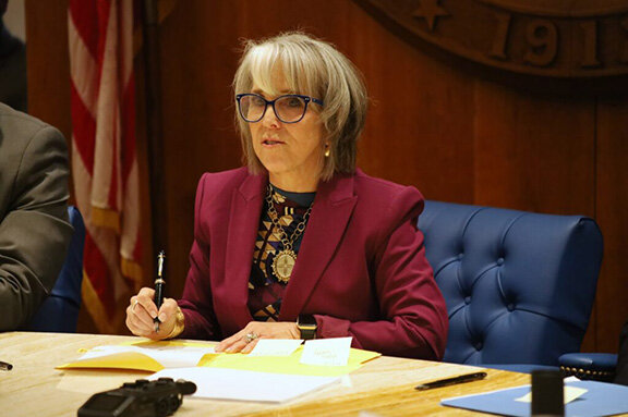 New Mexico Gov. Michelle Lujan Grisham signs Senate Bill 3, which seeks to rebuild the state’s behavioral health system, during a signing ceremony at the New Mexico Legislature on Feb. 27, 2025.