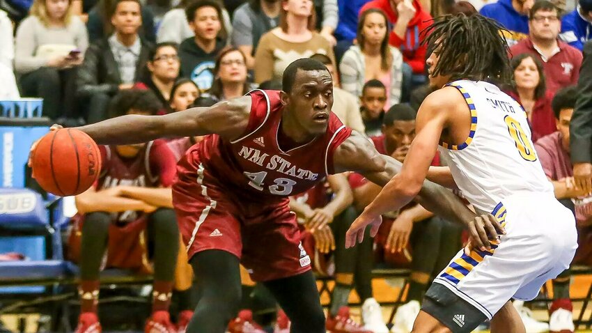 Nick Ellis .New Mexixo State's Pascal Siakam dribbles as CSUB's Math Smith defends in the first half Saturday night at The Icardo Center in Bakersfield.