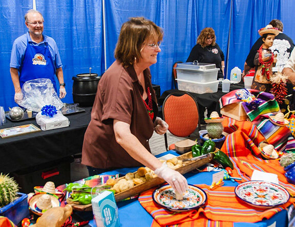Staff serving at a previous Taste of Las Cruces.