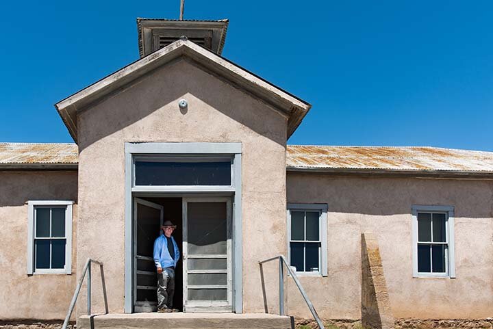 BLM Archaeologist Martin Goetz at the restored schoolhouse at the Lake Valley Historic Townsite in New Mexico.