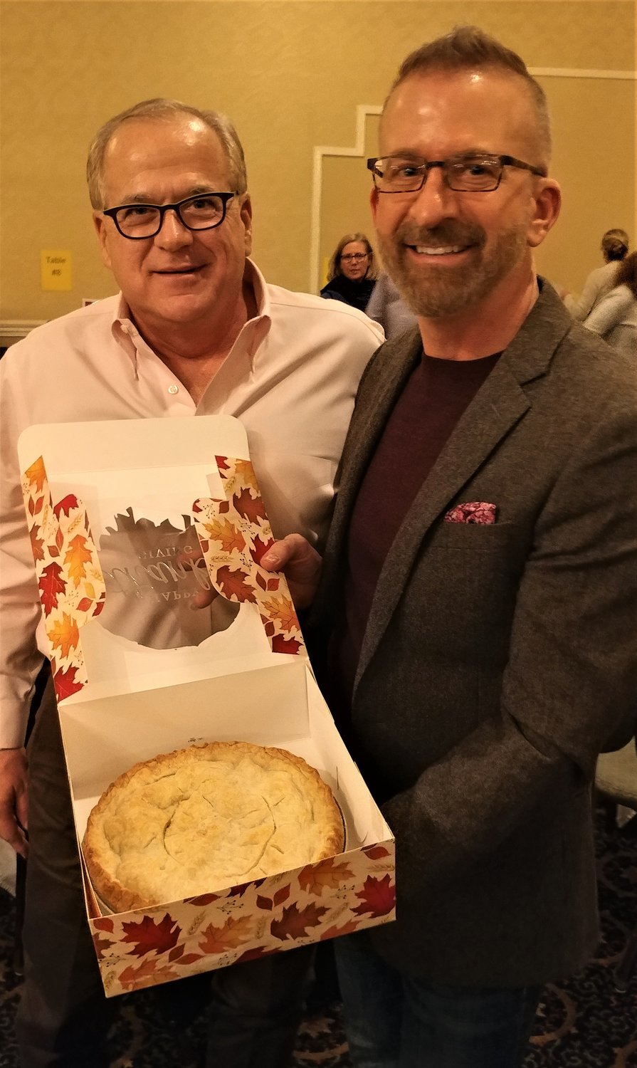 Las Cruces dentists Phil Born, left, and Brian Gilbert, each bid $500 to share in a homemade apple pie won during a live auction at the Nov. 15 PFLAG-Las Cruces fundraising gala. The pie was made by former PFLAG-Las Cruces President Merlyn Risser.