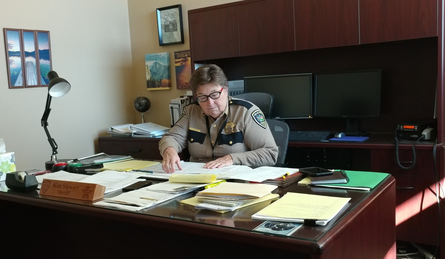 Doña Ana County Sheriff Kim Stewart at her desk at the county sheriff’s office