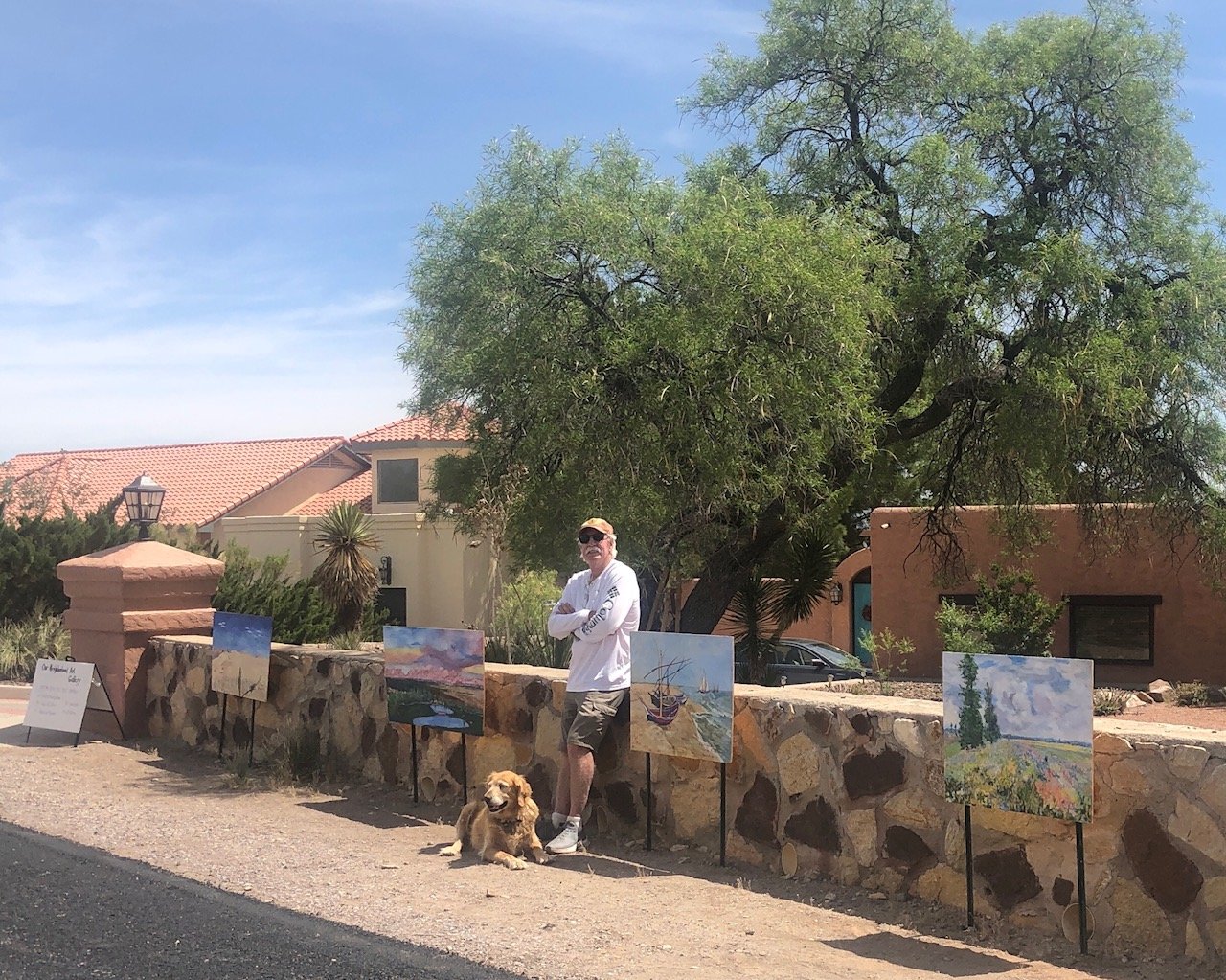 Paul Maxwell stands out in front of “Our Neighborhood Gallery,” which he has created in front of his Picacho Hills Home.