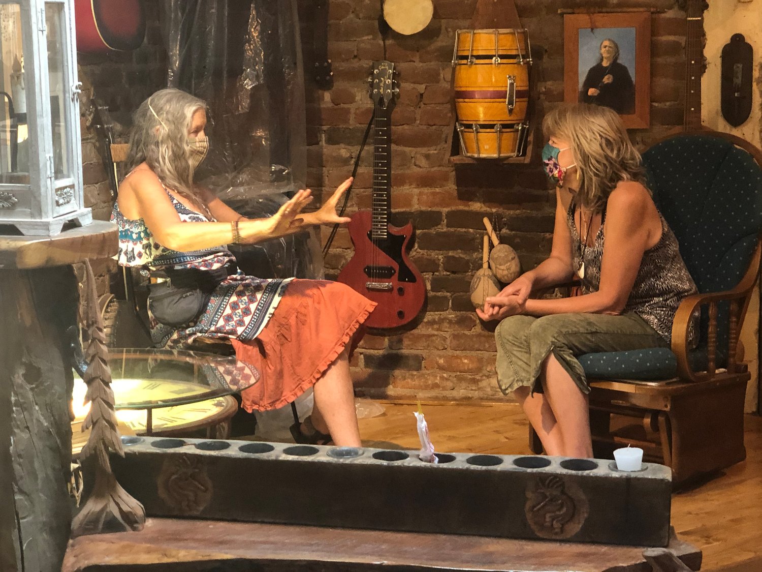 Renya Craig and Lisa Debussy chat on the stage at the new Tranquilbuzz Coffee Shop location.