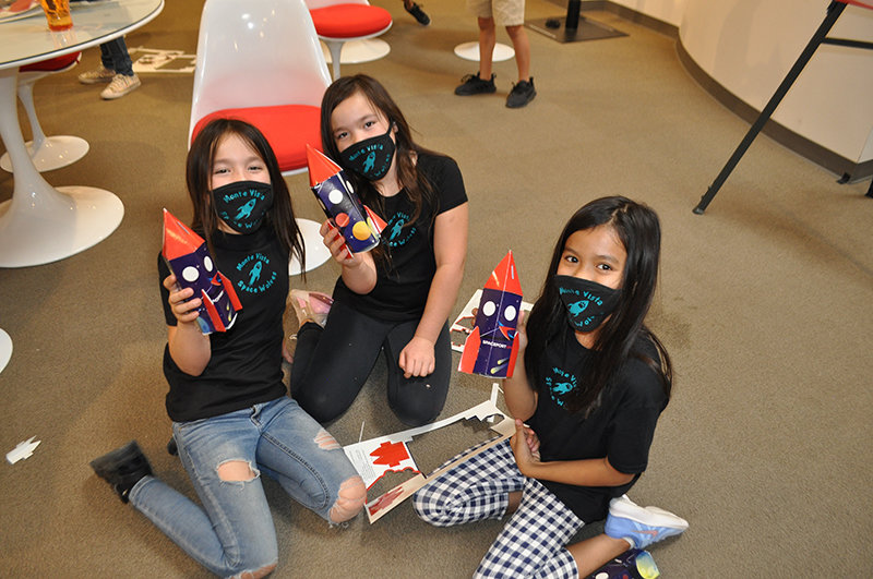 Ashaya Potter, her twin Alailia Potter, and Zeanna Roque finish up their projects at Spaceport America during a field trip June 4. “I learned there is a lot of space,” Roque said. “I actually want to be an astronaut.”